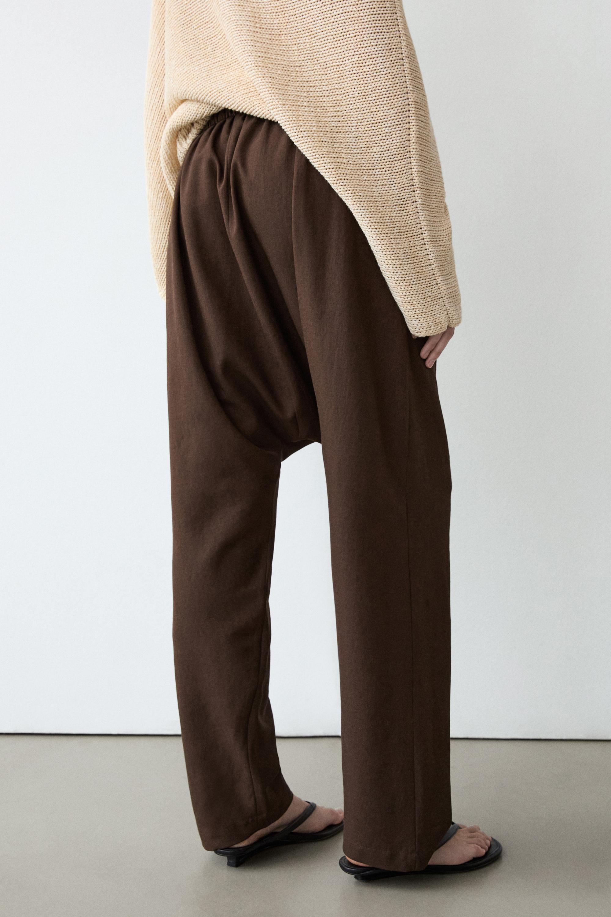 Baggy trousers with pleated details